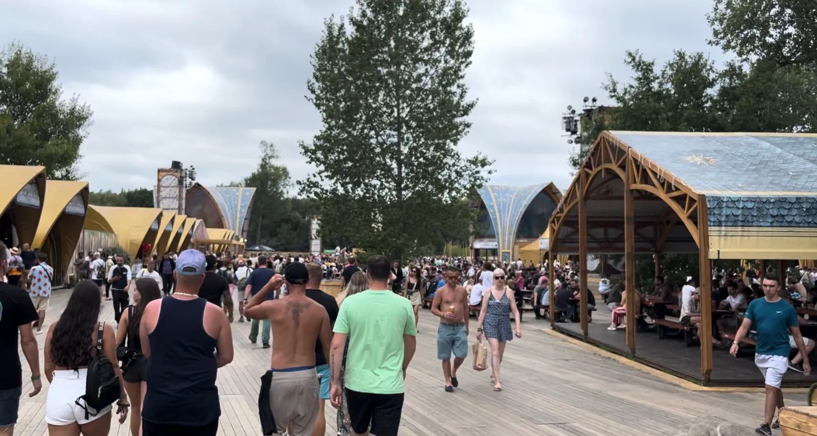 The Dreamville Marketplace avenue with its wooden pavilions and food areas